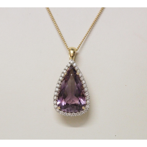 629 - A large amethyst and diamond cluster pendant, of modern triangular shape, on hallmarked 18ct yellow ... 