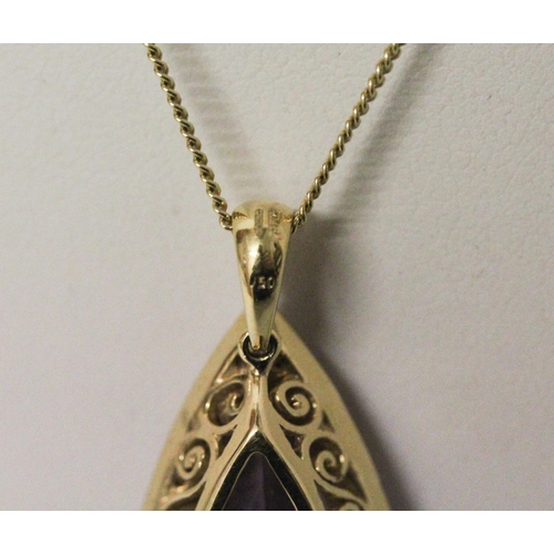 629 - A large amethyst and diamond cluster pendant, of modern triangular shape, on hallmarked 18ct yellow ... 