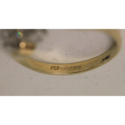 630 - A diamond two stone ring, on cross over setting, hallmarked 18ct yellow gold band. Ring size O/P, 3.... 