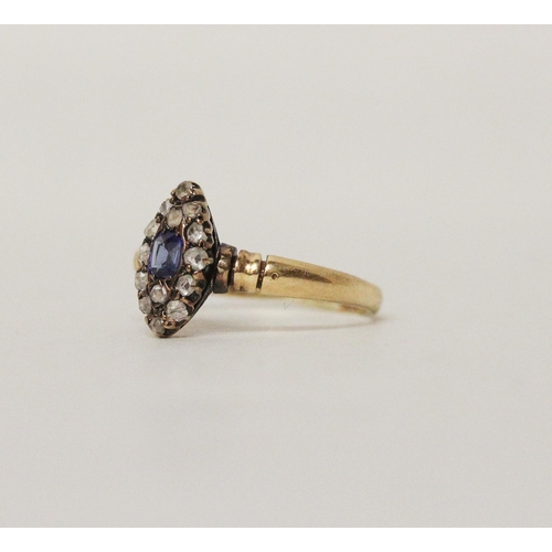 643 - An antique sapphire and diamond marquise panel cluster ring, rose cut diamonds surrounding a cushion... 