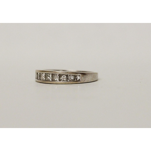 677 - A modern diamond half hoop eternity ring, channel set with 1 carat of princess cut diamonds, hallmar... 