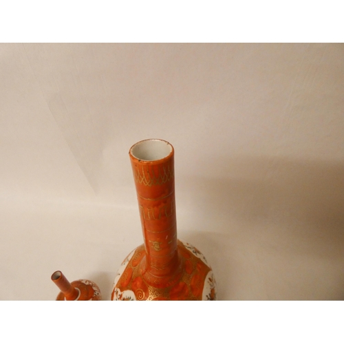 281 - Satsuma bottle vase, 21cms tall, together with a miniature vase, both with character marks to base.