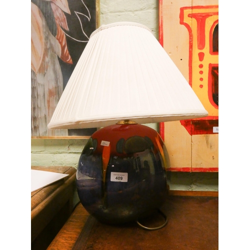 409 - A Poole Pottery Delphis ware table lamp with shade