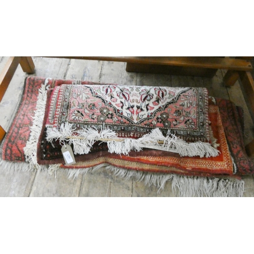 421 - A collection of assorted small Persian rugs and mats