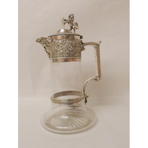 547 - Elkington & Co - Edwardian silver plated and glass claret jug with lion and shield finial