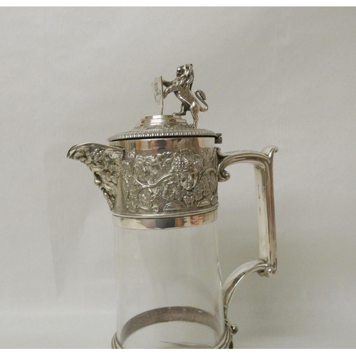 547 - Elkington & Co - Edwardian silver plated and glass claret jug with lion and shield finial