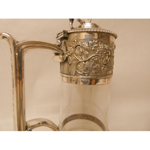 547 - Elkington & Co - Edwardian silver plated and glass claret jug with lion and shield finial