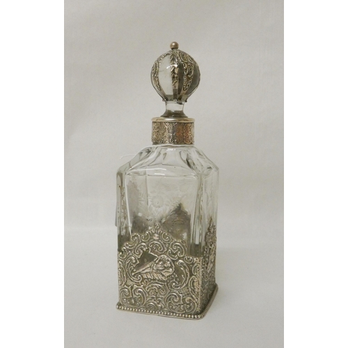 549 - Continental silver mounted cut glass liqueur decanter of large eau de toilette bottle. With silver m... 