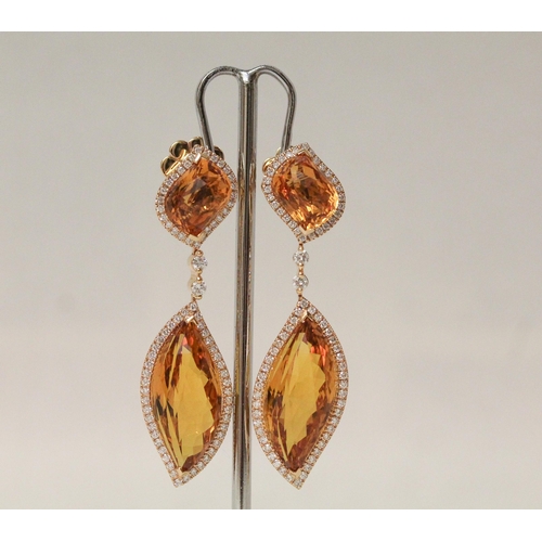 679 - An impressive pair of faceted tourmaline and diamond drop earrings, in hallmarked 18ct gold. In fitt... 