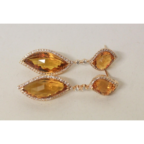 679 - An impressive pair of faceted tourmaline and diamond drop earrings, in hallmarked 18ct gold. In fitt... 