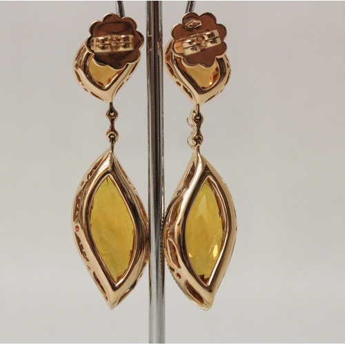 679 - An impressive pair of faceted tourmaline and diamond drop earrings, in hallmarked 18ct gold. In fitt... 