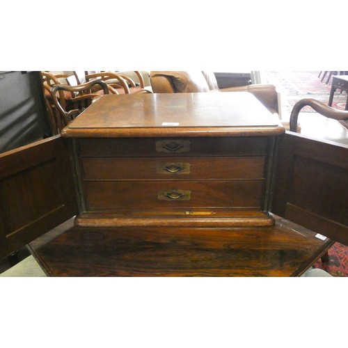 495 - Victorian walnut canteen  box, the cupboard style doors opening to three cutlery drawers, full of la... 