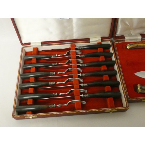 521A - An Antler and silver collar mounted set of six fish knives and forks in red leather box, retailed by... 