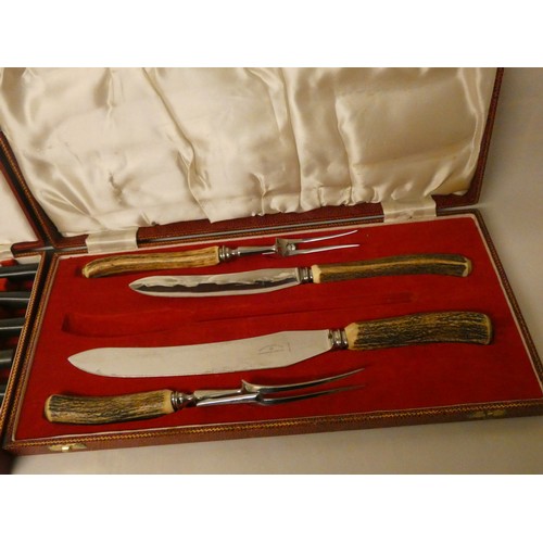 521A - An Antler and silver collar mounted set of six fish knives and forks in red leather box, retailed by... 