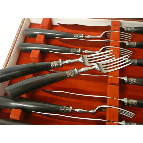 521A - An Antler and silver collar mounted set of six fish knives and forks in red leather box, retailed by... 