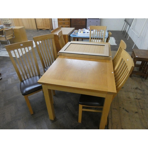 45 - A chunky light-oak extending dining table with centre leaf and six matching high slat back dining ch... 