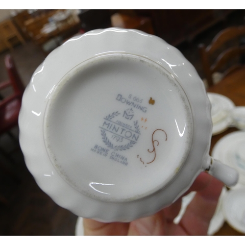 60 - A collection of Minton bone china, white and gilt bordered blue decorated dinner and tea ware