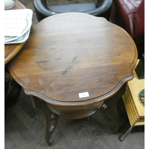 62 - A circular two tier Edwardian mahogany occasional table