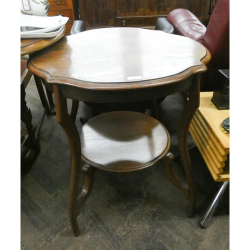 62 - A circular two tier Edwardian mahogany occasional table