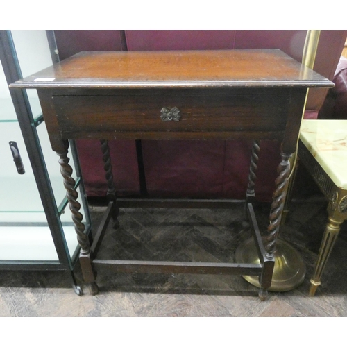 67 - A oak occasional table on barley twist legs