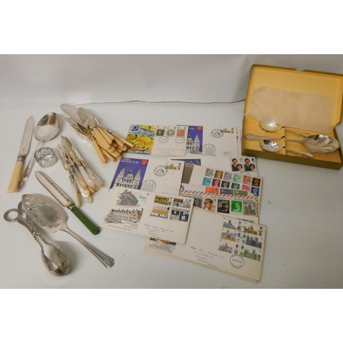 82 - A collection of assorted cutlery and stamps