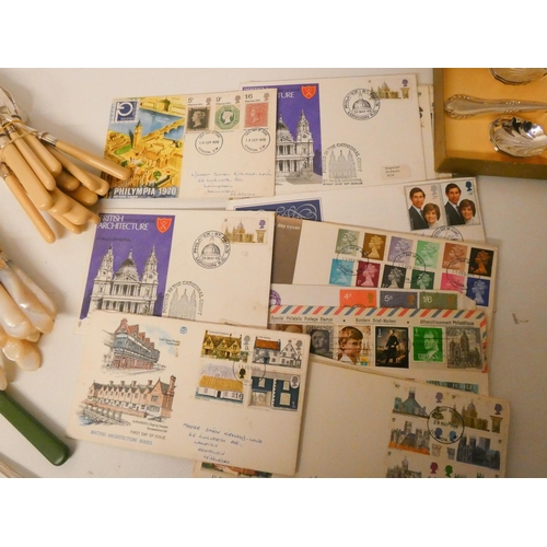 82 - A collection of assorted cutlery and stamps