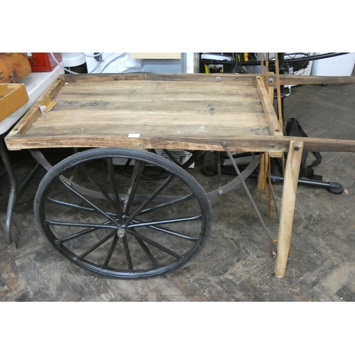 425 - A vintage style wooden two wheeled pull along cart