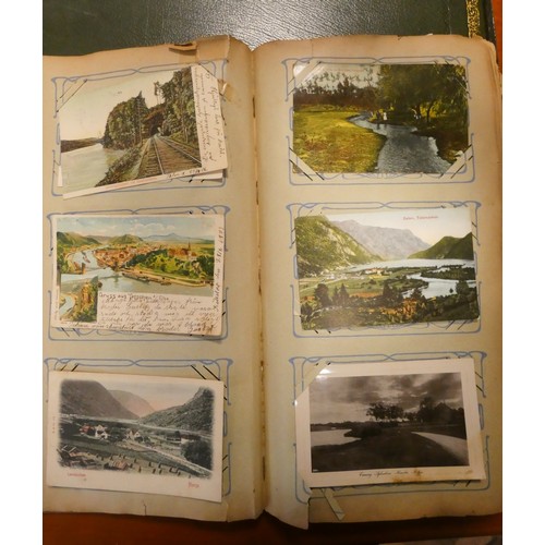 286 - A collection of English and foreign postcards together with two books of autographs etc