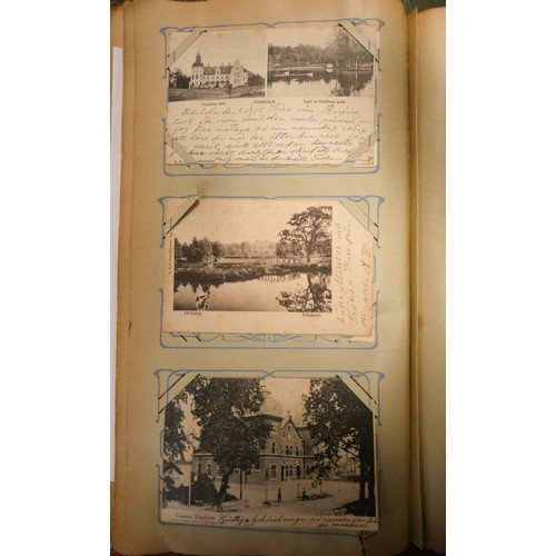 286 - A collection of English and foreign postcards together with two books of autographs etc