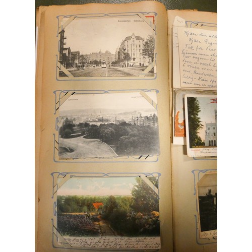 286 - A collection of English and foreign postcards together with two books of autographs etc