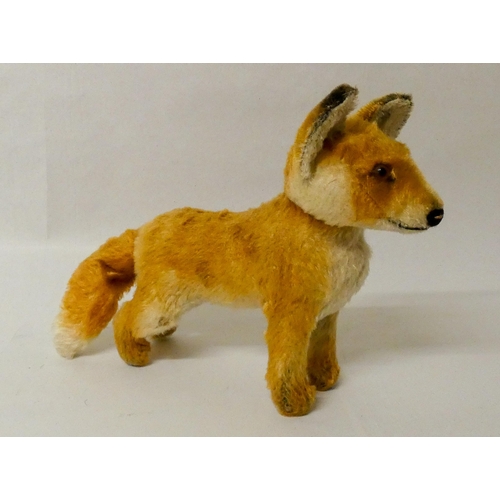 650 - A vintage Steiff fox cub mohair toy, steel button in left ear. Approximately 25cm nose to tail