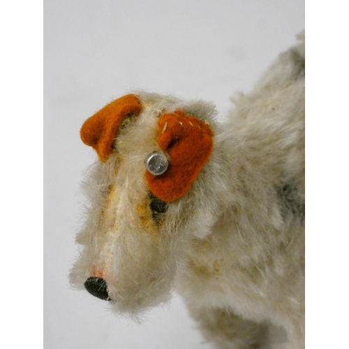 653 - Steiff - vintage miniature mohair model of a Fox Terrier, steel button to left ear. 9.5 cms tall