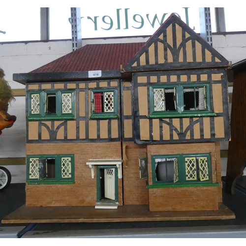 416 - A child's small dolls house with interior fittings and a small quantity of furnishings