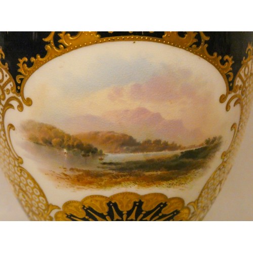 201 - A Coalport twin handled vase painted with a view of the lakes within scale gilt reserves against a b... 