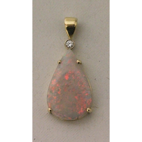 635 - Australian opal and diamond pendant, large tear drop shaped white opal claw set, with diamond set to... 