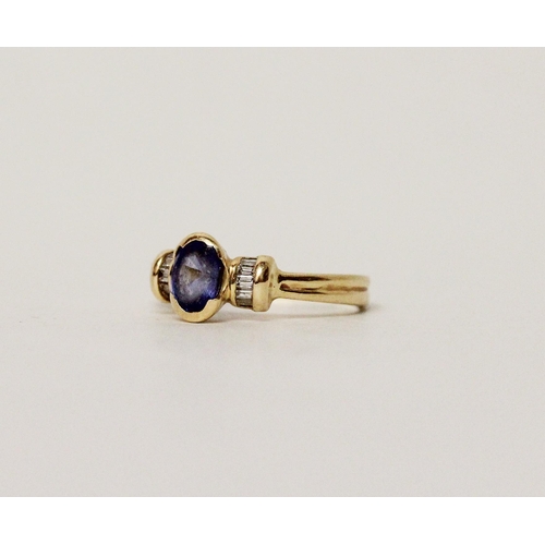 641 - A Ceylon sapphire and diamond ring, the oval sapphire flanked by baguette cut diamonds, on 18ct yell... 