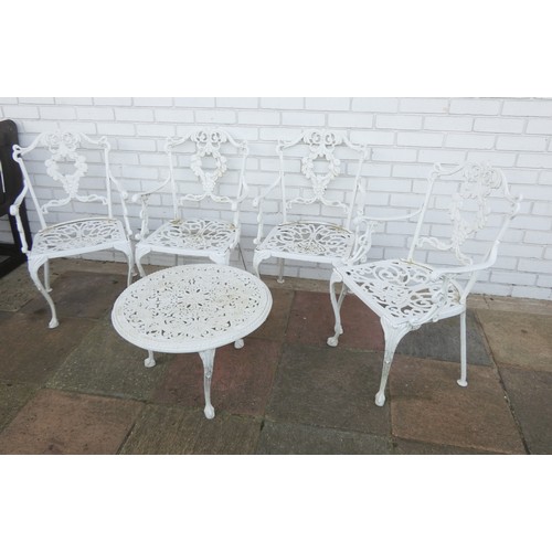 424 - A set of four matching white painted garden chairs together with a white painted garden coffee table