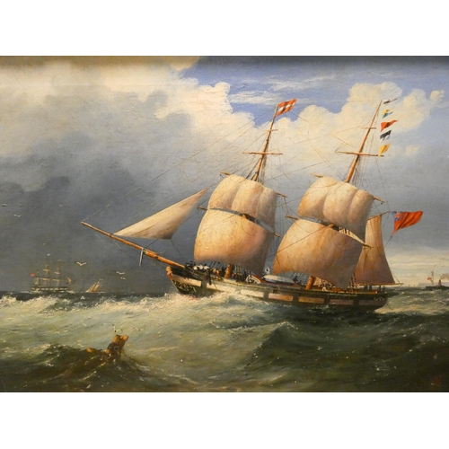 261 - A 19th Century oil on canvas of a British Brigantine off the coast, monogramed W.S, lower right, ima... 