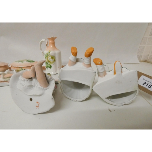 215 - A collection of Bisque Piano Babies and a vintage china dressing table set