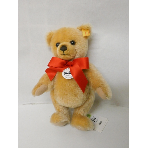 217 - A Steiff golden plush joined teddy bear in fitted box. Teddy bear is 23cm tall with growler