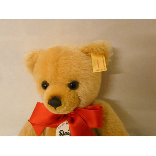 217 - A Steiff golden plush joined teddy bear in fitted box. Teddy bear is 23cm tall with growler