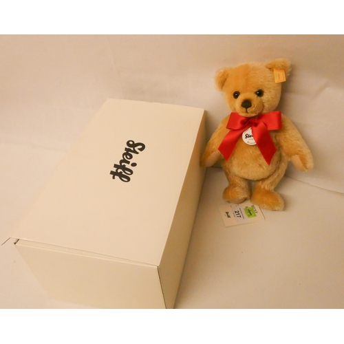 217 - A Steiff golden plush joined teddy bear in fitted box. Teddy bear is 23cm tall with growler