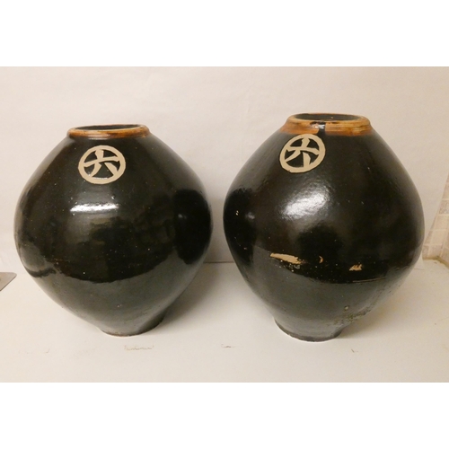 219 - A large pair of Chinese Cheng rice wine vases, standing 45cm tall