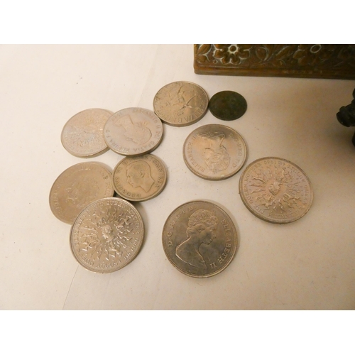 228 - An Arts and Crafts brass casket, two carved stone buffalo and a collection of commemorative crowns