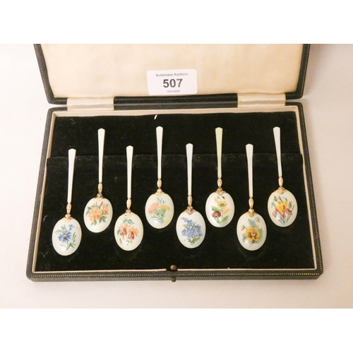 507 - A set of eight hallmarked silver gilt and enamel coffee spoons, enamelled with summer flowers, in a ... 