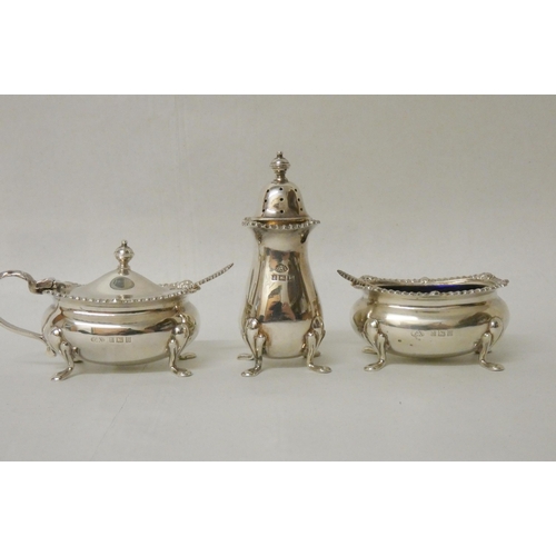 510 - A hallmarked silver three piece cruet set...