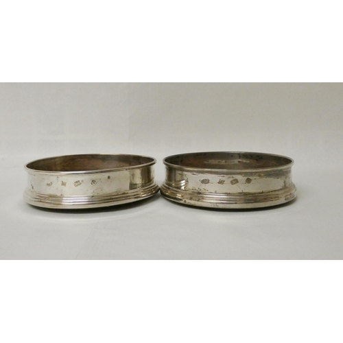 513 - A pair of modern hallmarked silver wine bottle coasters