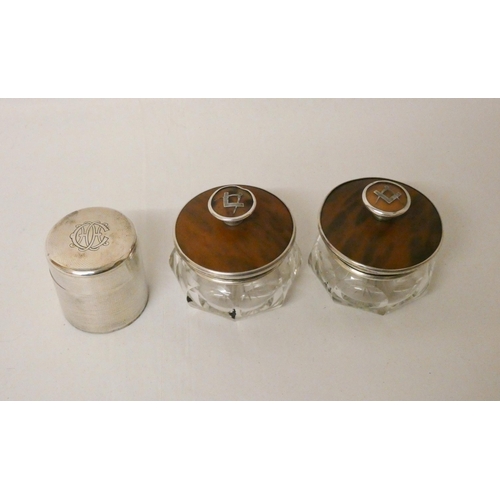 514 - A pair of silver and tortoiseshell mounted gentleman's trinket jars with masonic motifs inset into t... 