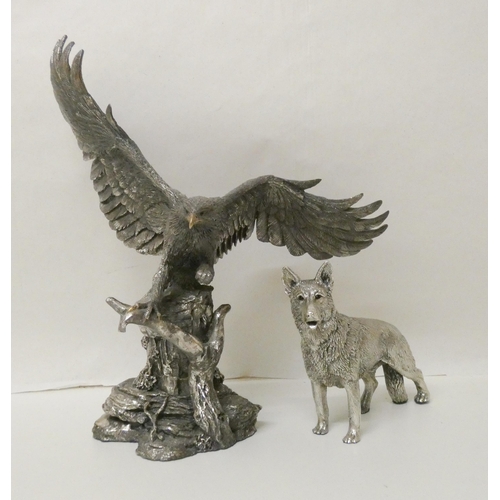 515 - Two silver covered models, one of a Golden Eagle, one of a German Shepherd. Eagle wingspan 25cm acro... 