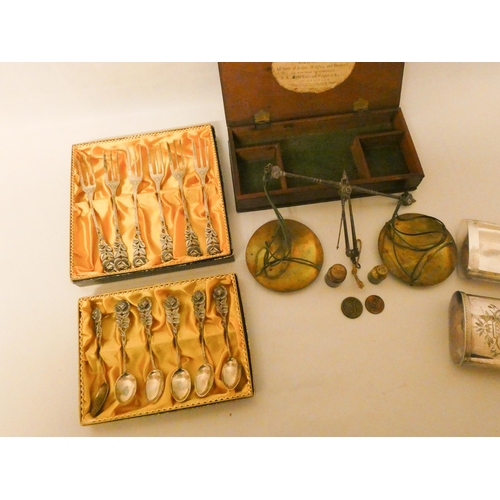 516 - A large engraved silver plated vesta case and a set of jewellers scales in fitted box together with ...